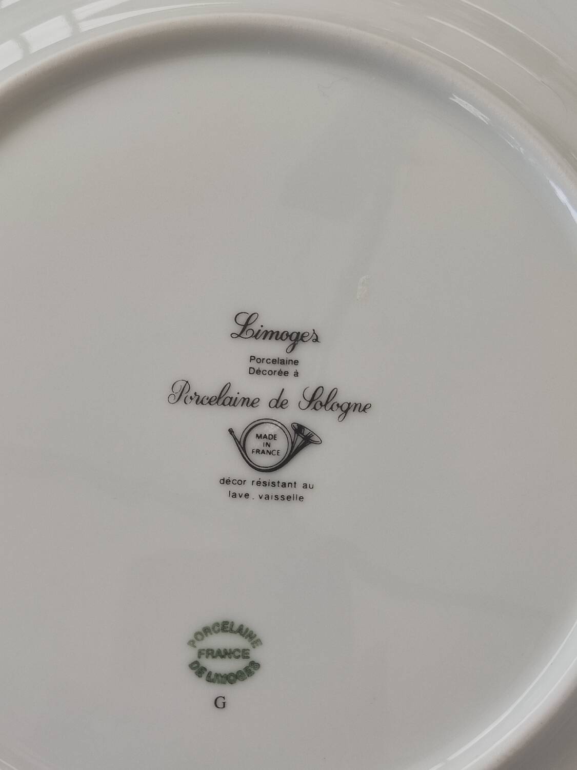 Six blue and gold Limoges porcelain dinner plates