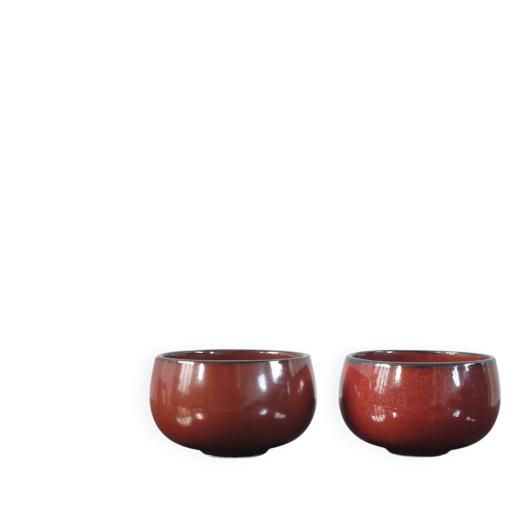 Set of vintage red glazed ceramic bowls.