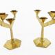 Pair of modernist three-armed solid brass candlesticks, circa 1960