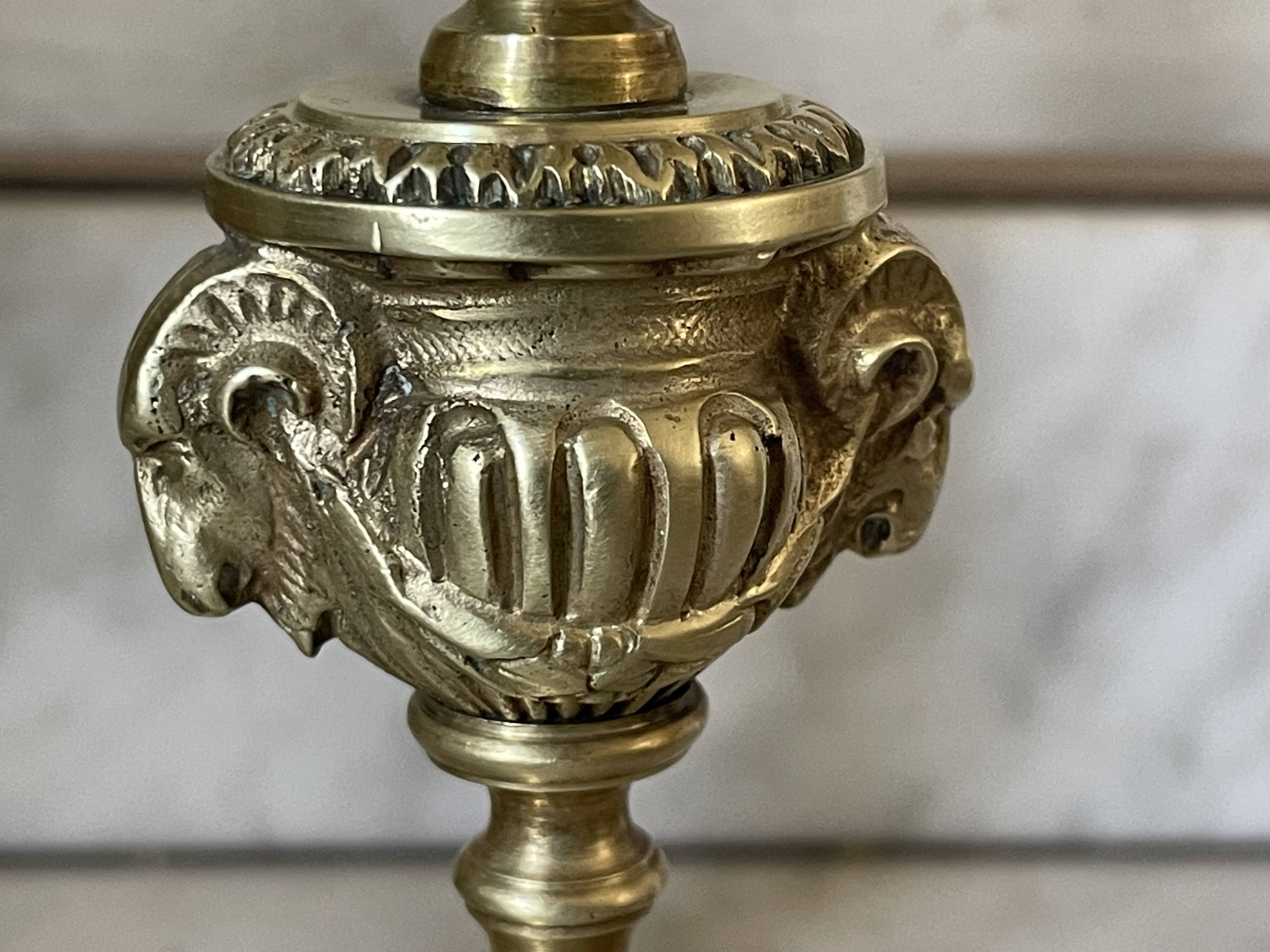 Pair of gilt bronze ram's head candlesticks, Louis XVI style, 19th century.