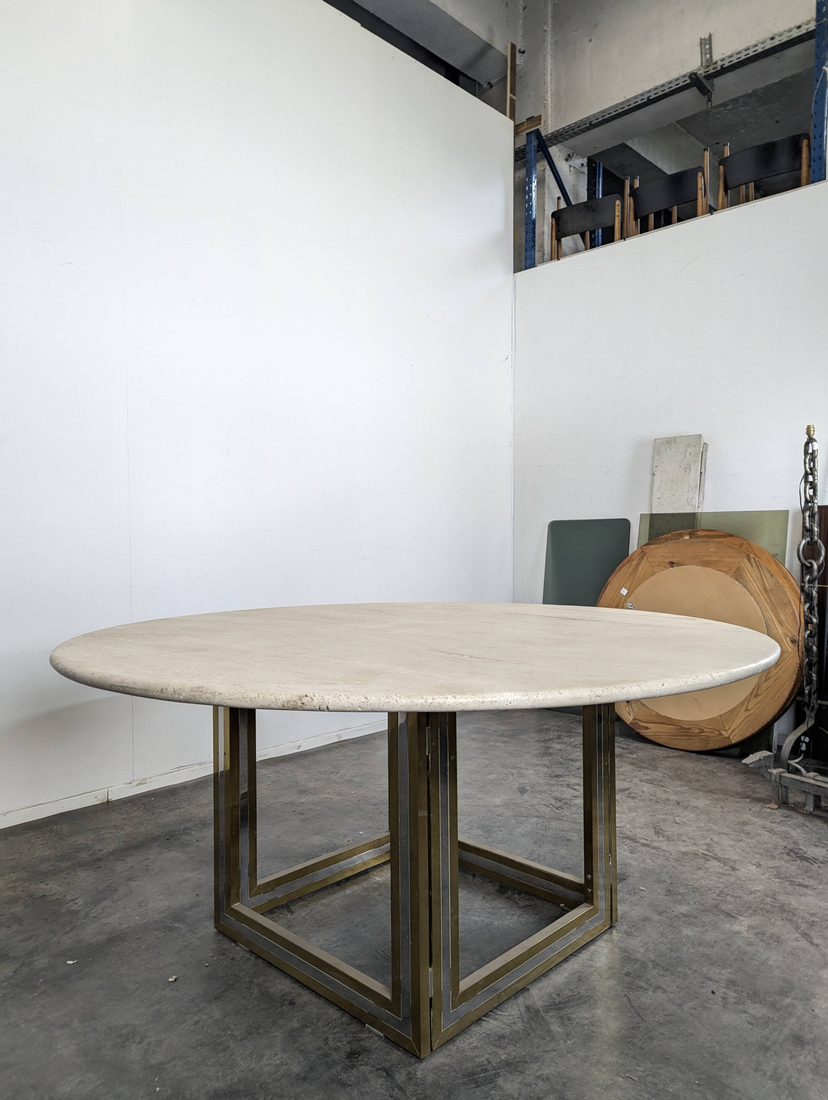 Italian dining table with a travertine top.