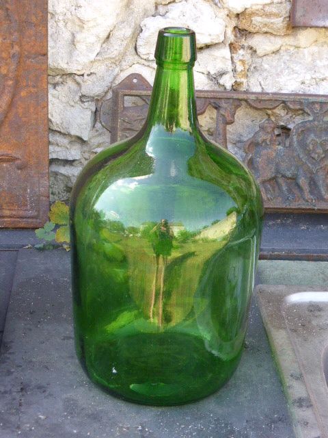 Dark green glass demijohn, vintage