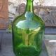 Dark green glass demijohn, vintage