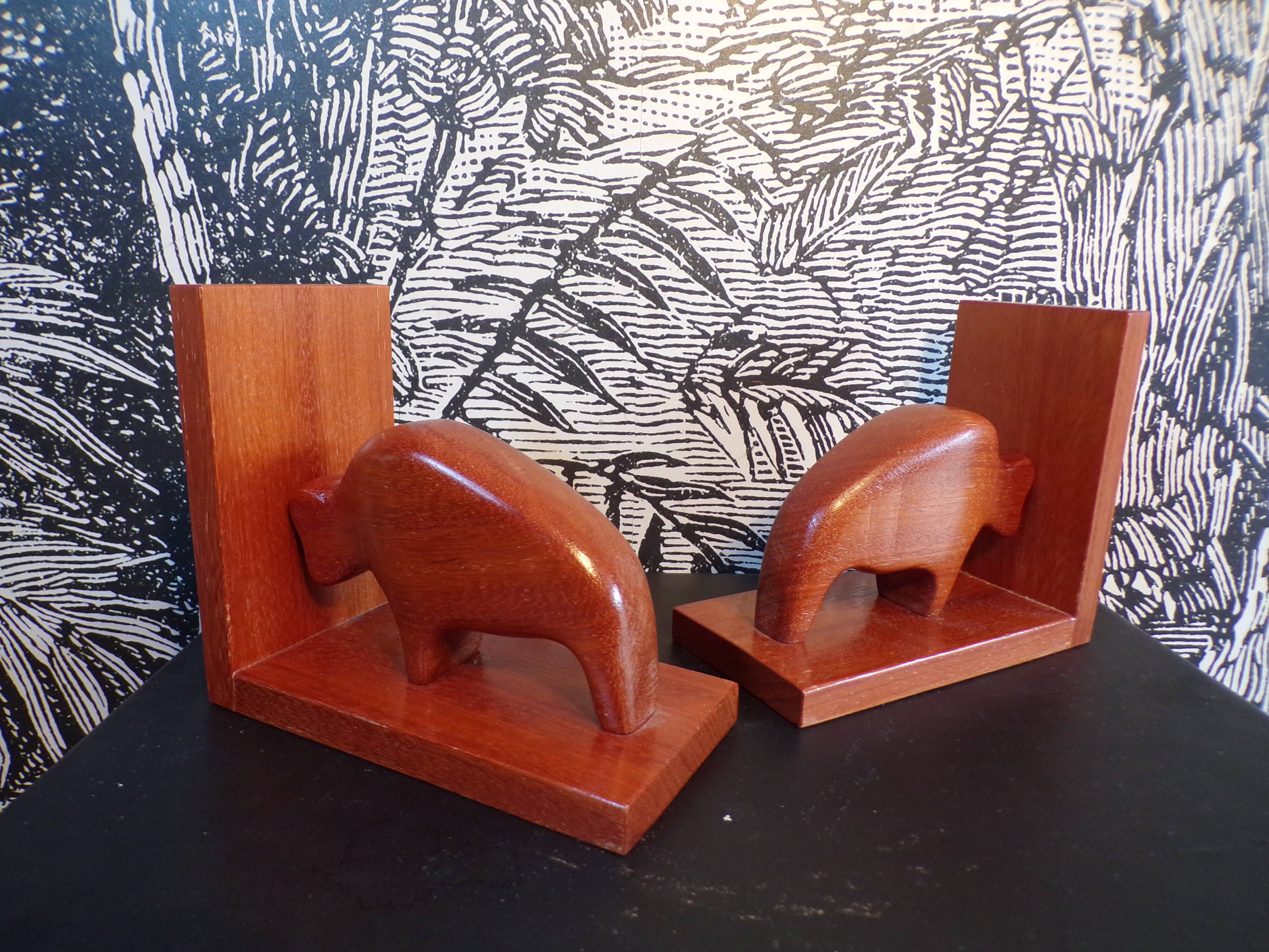 Pair of teak bookends in the shape of a bison