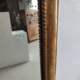 Long wooden mirror and gilded stucco with pearl rays H: 2m45 L: 40cm
