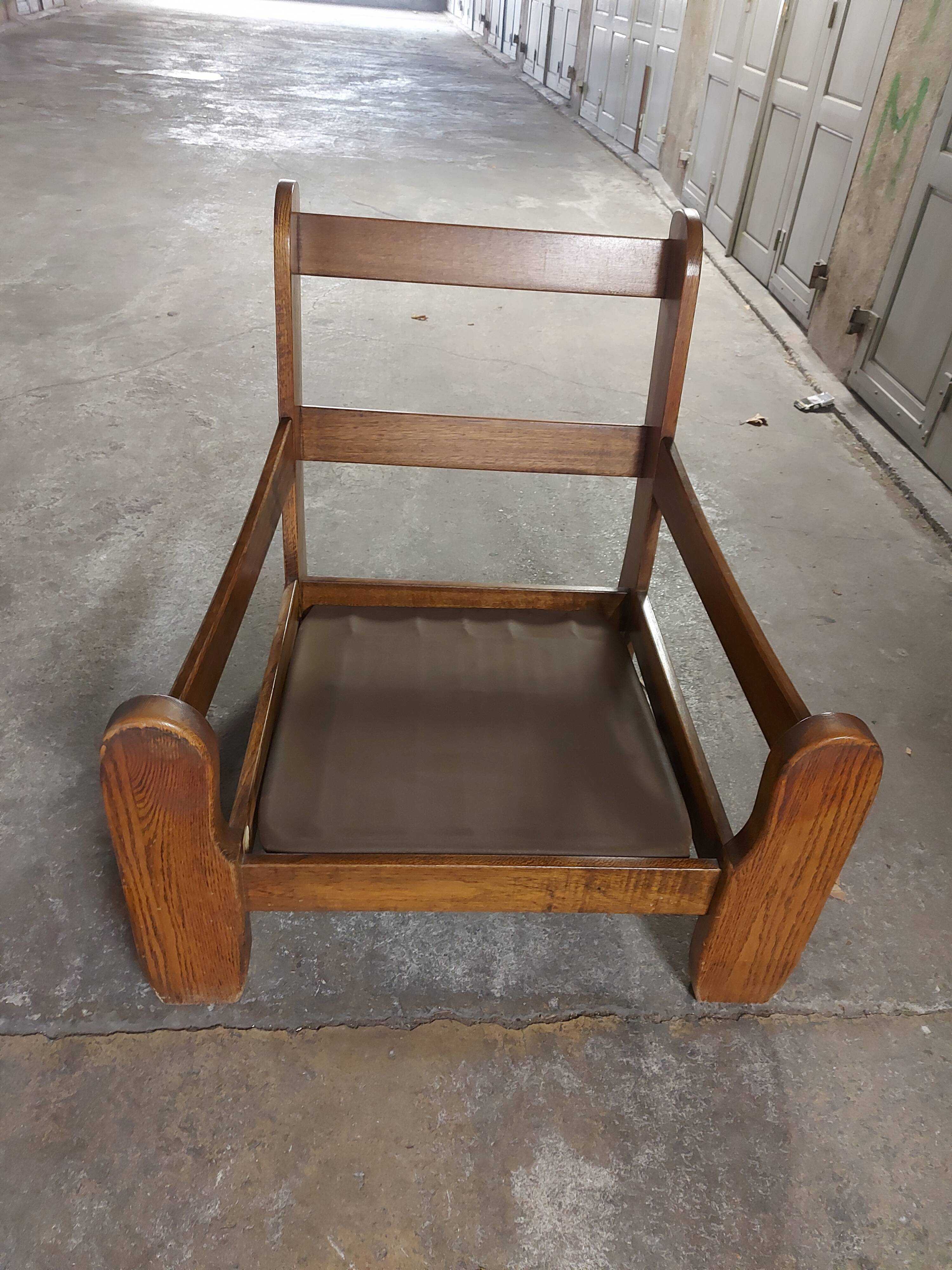 Armchairs in leather and vintage wood 70's