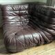 Togo set by Ligne Roset in vintage pink, plum, and burgundy leather.