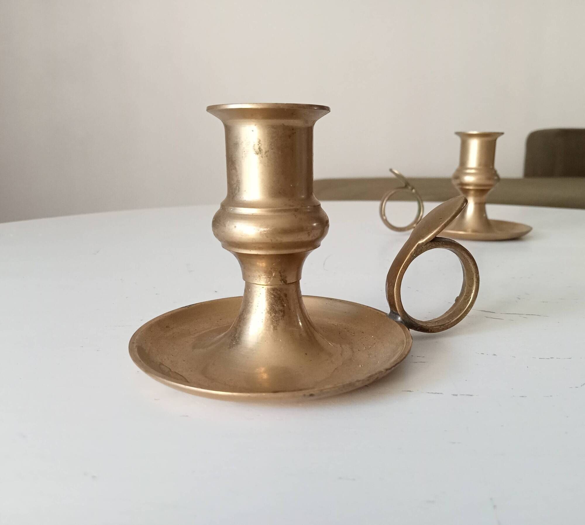 Antique hand candlestick in solid gilded brass.