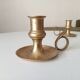 Antique hand candlestick in solid gilded brass.