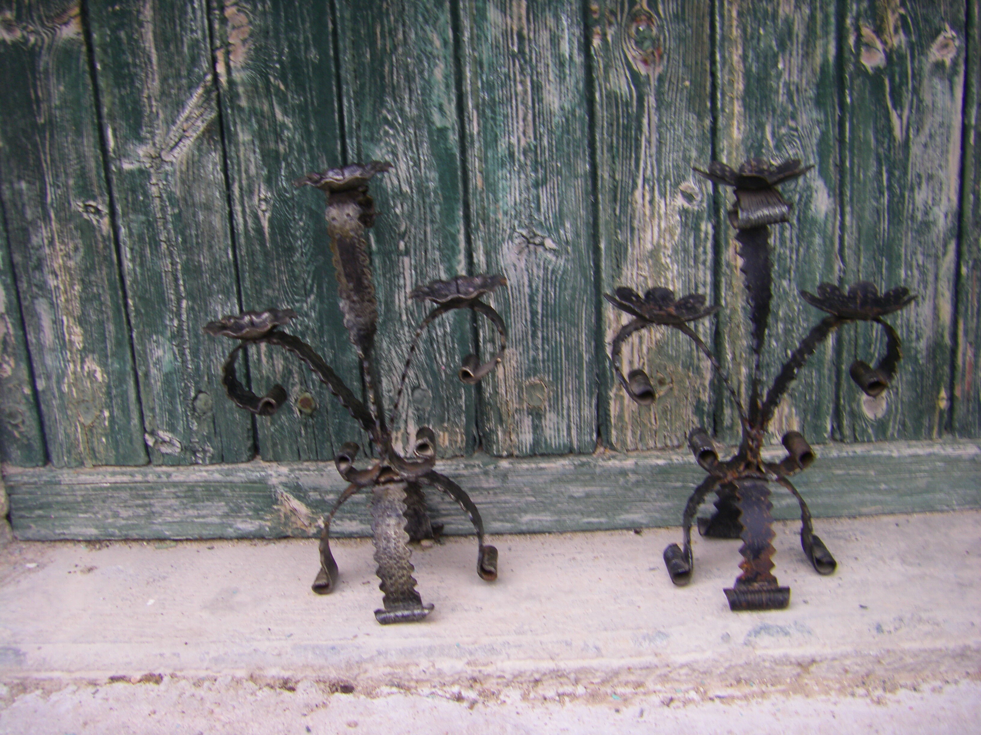 Two wrought iron chandeliers