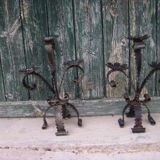 Deux chandeliers en fer forgé
