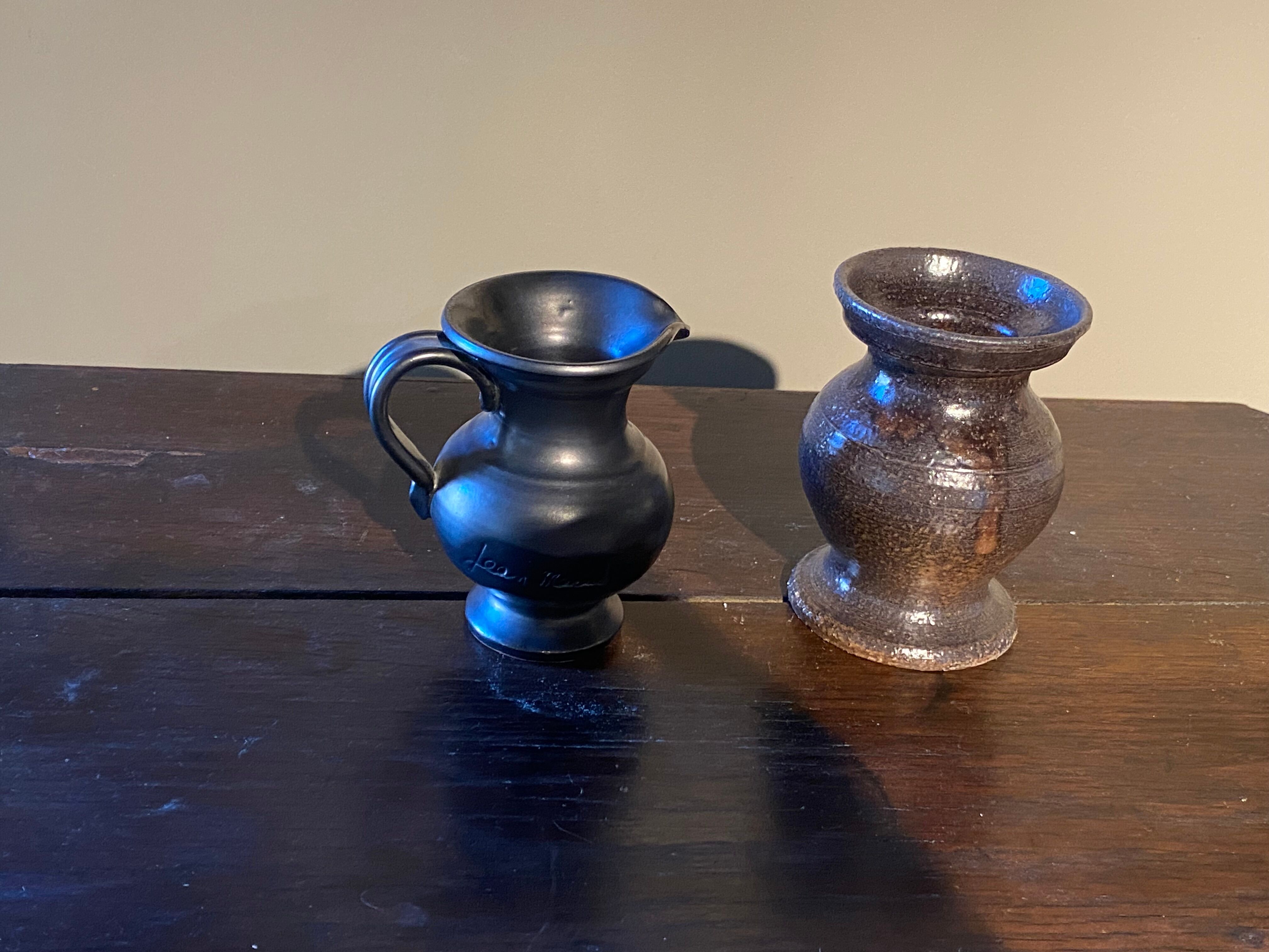 Set of 2 Jean Marais ceramic pitchers