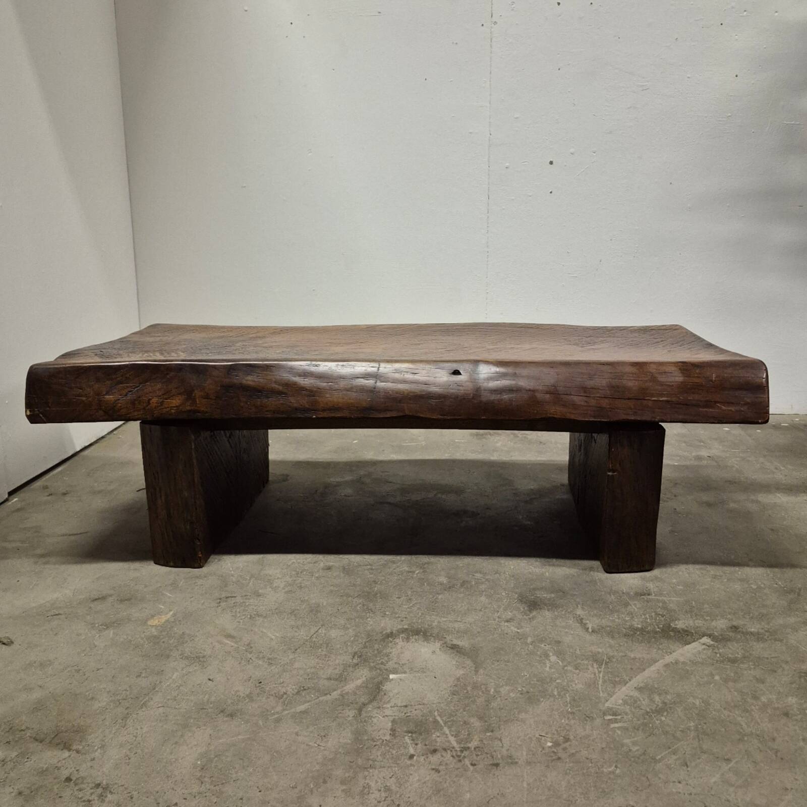 Rustic solid oak coffee table with a one piece top, France 1950s