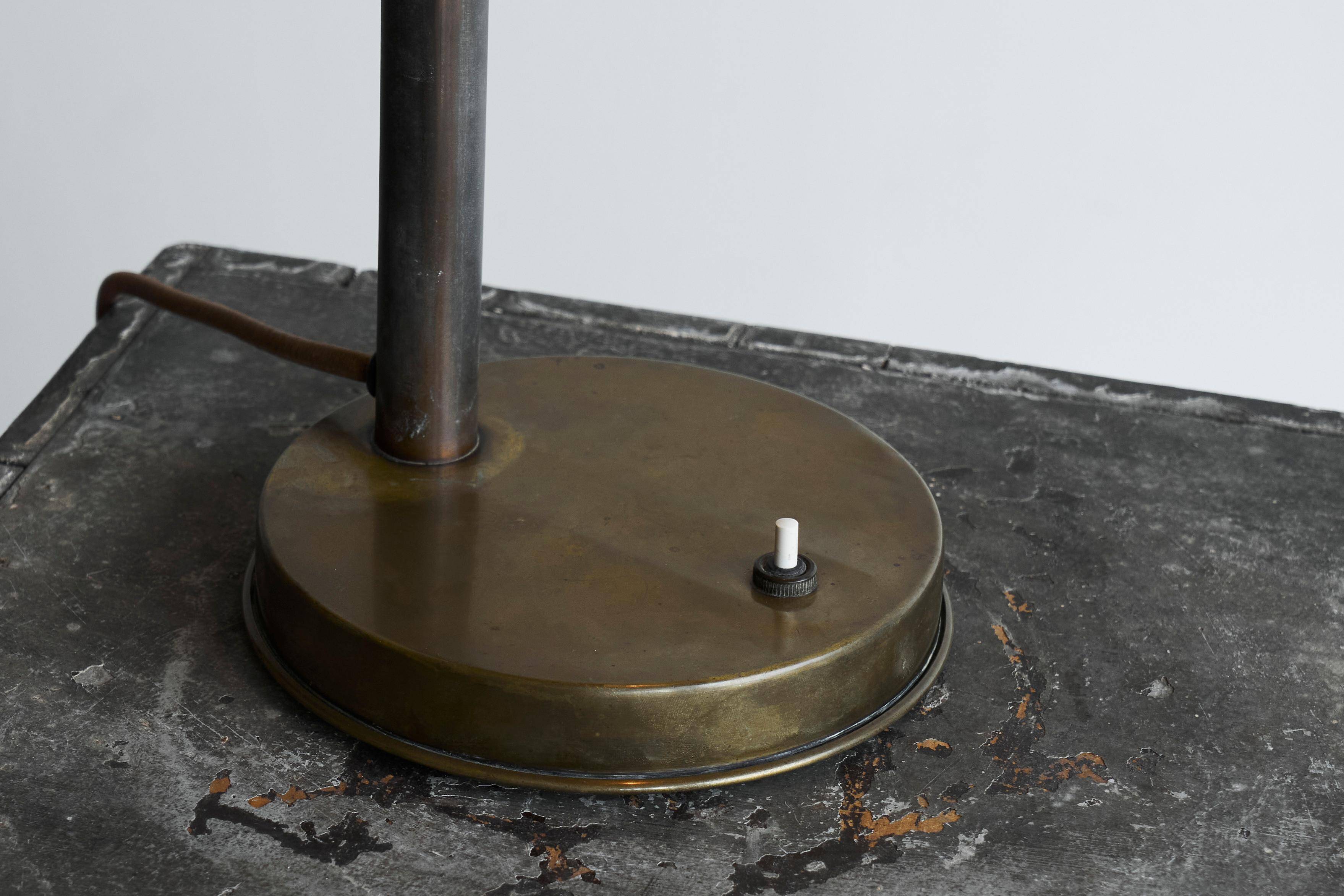 Bauhaus style table lamp in patinated brass from the 1930s.