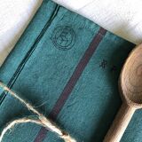 Old linen and cotton tea towel tinted in fir green