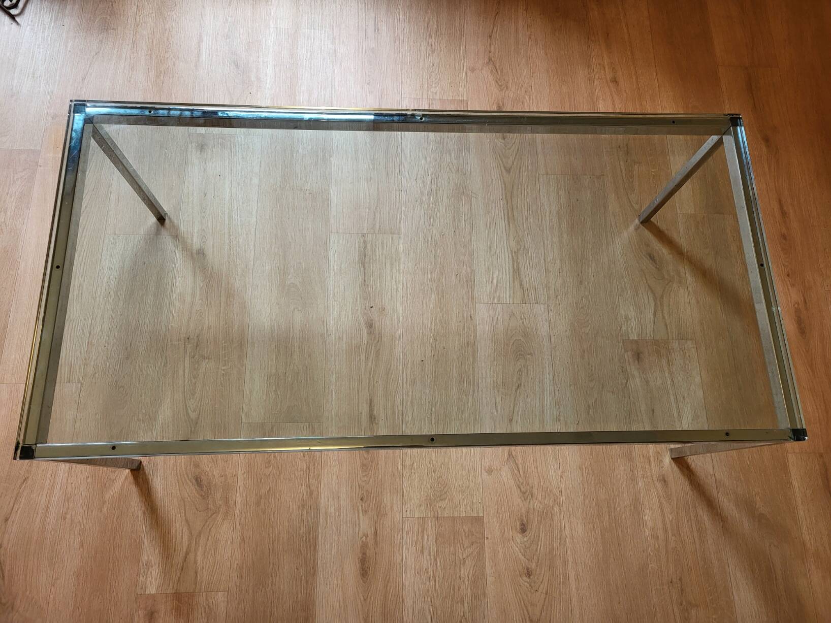 Knoll coffee table with smoked glass top and chrome metal.