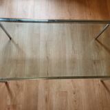 Knoll coffee table with smoked glass top and chrome metal.