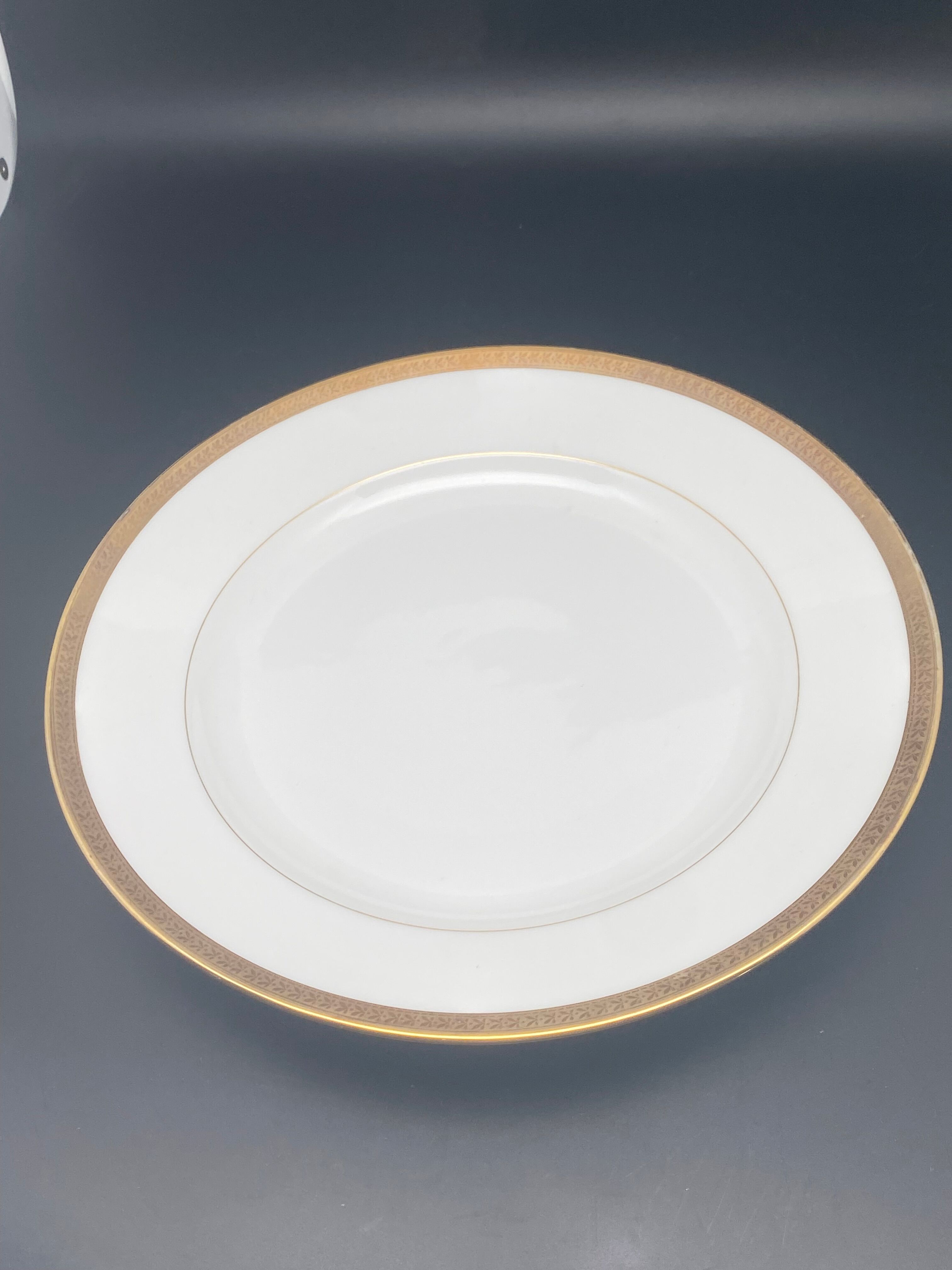Round porcelain dish from Limoges golden tower