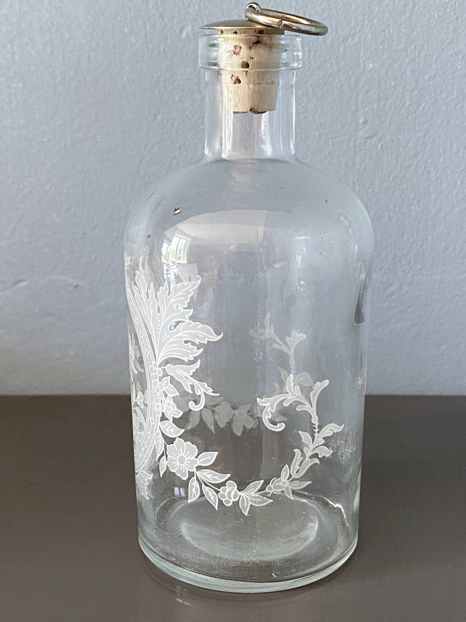 Pair of antique wheel-engraved glass bottles - good condition