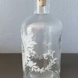 Pair of antique wheel-engraved glass bottles - good condition