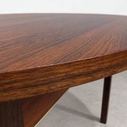 Extendable round rosewood dining table