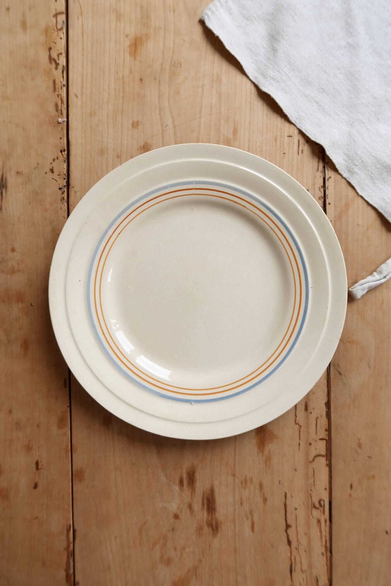 Ivory ironstone dessert plate – Pale blue and orange borders