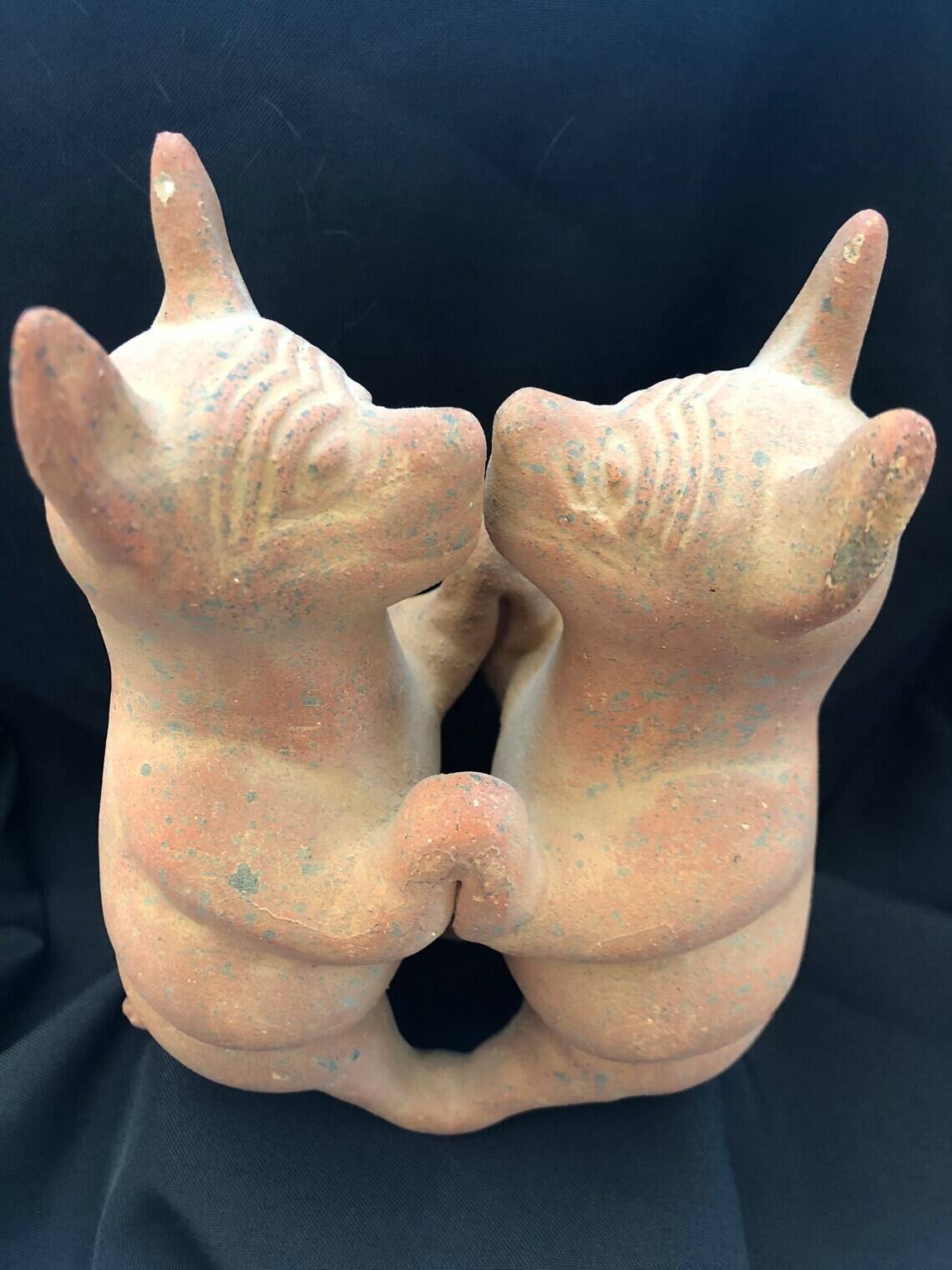 Pre-columbian style terracotta sculpture dancing fat dogs from colima mexico culture
