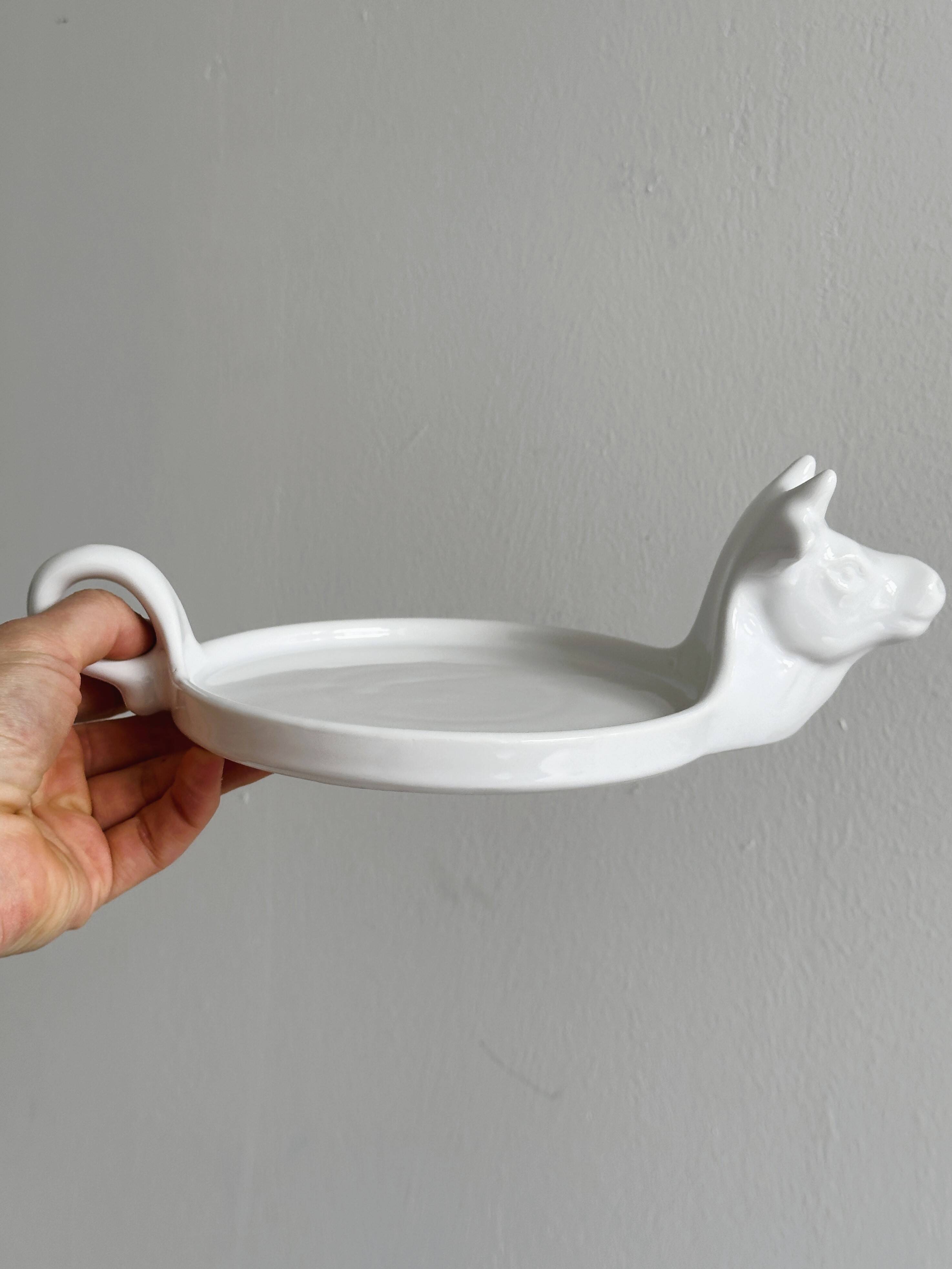 White porcelain cheese dish with handle and cow's head