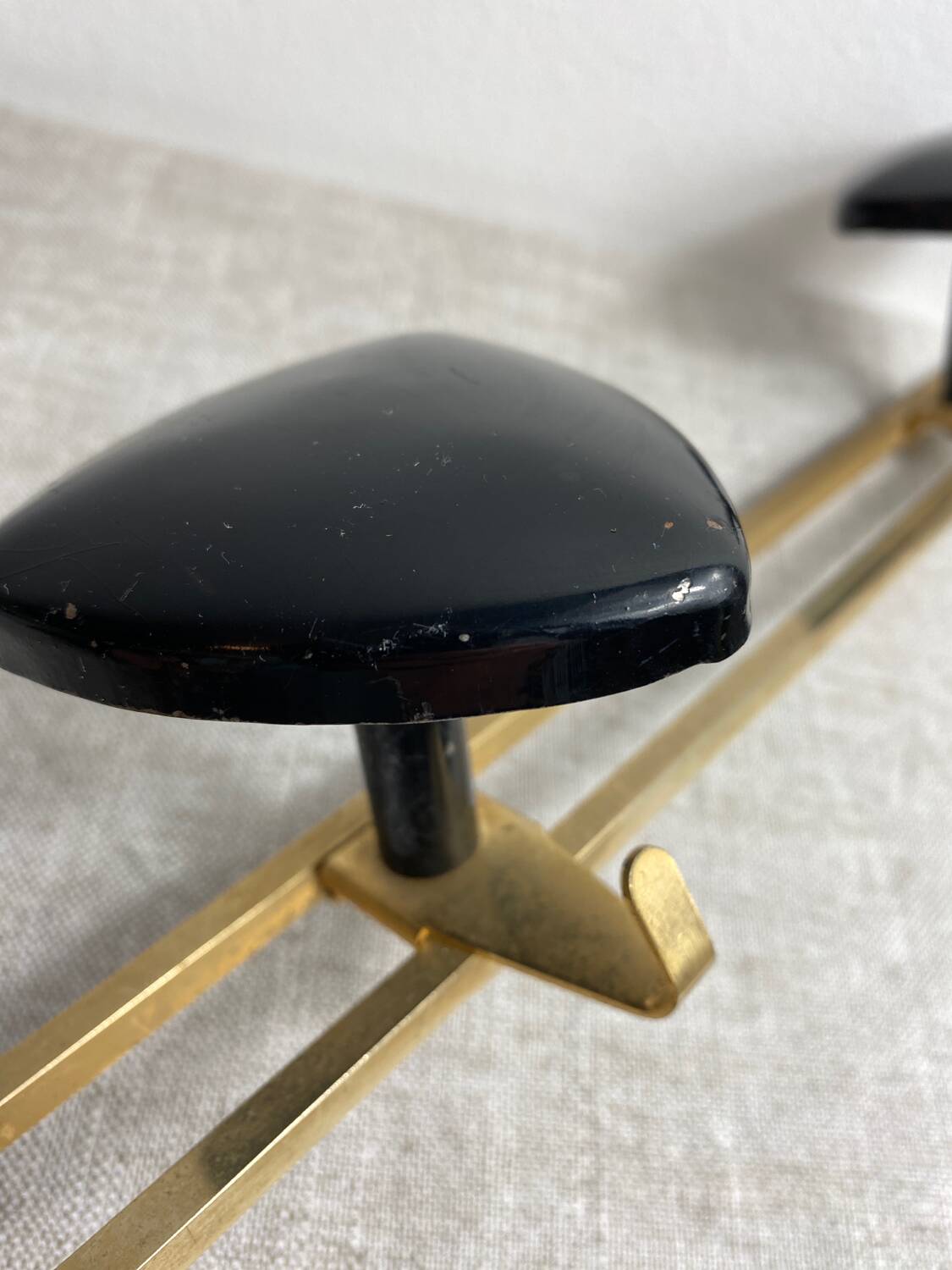 Wall-mounted coat rack with 3 hooks from the 1960s.