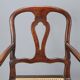 Antique walnut armchair with caned seat, Italy, 18th century