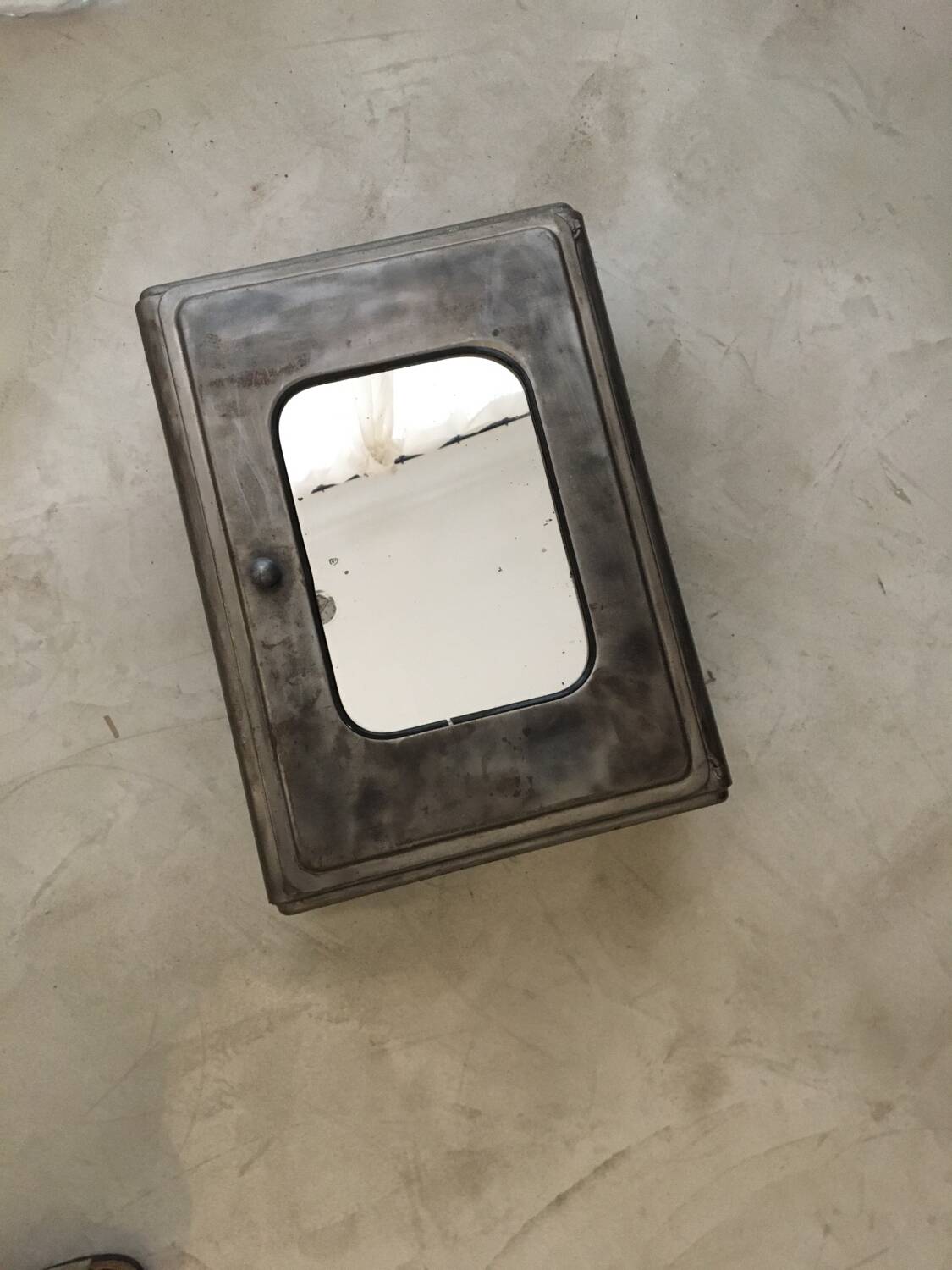 Gray metal medicine cabinet