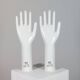 Pair of authentic vintage jewellery displays in industrial porcelain representing hands.