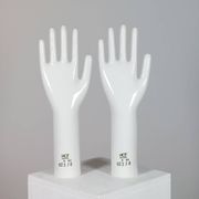 Pair of authentic vintage jewellery displays in industrial porcelain representing hands.