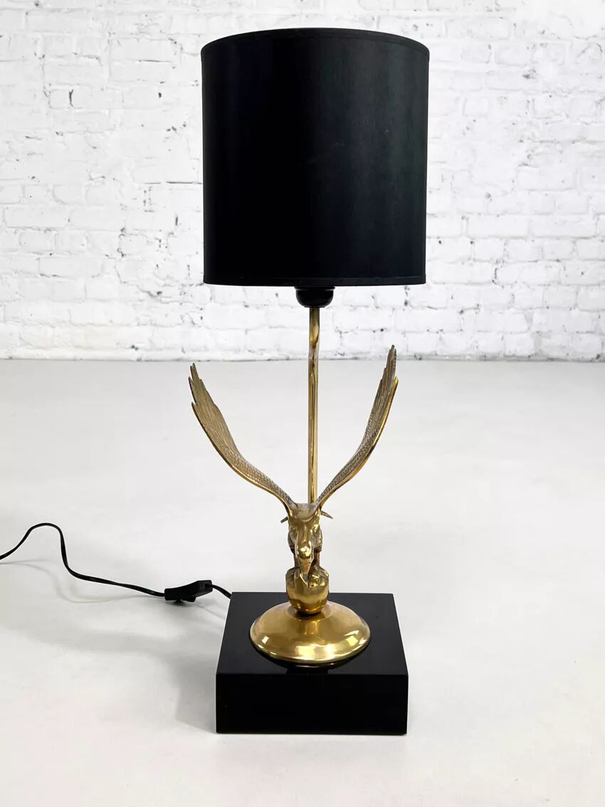 Brass lamp on black lacquered wooden base