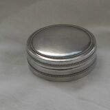 Small round silver metal box SNPA.