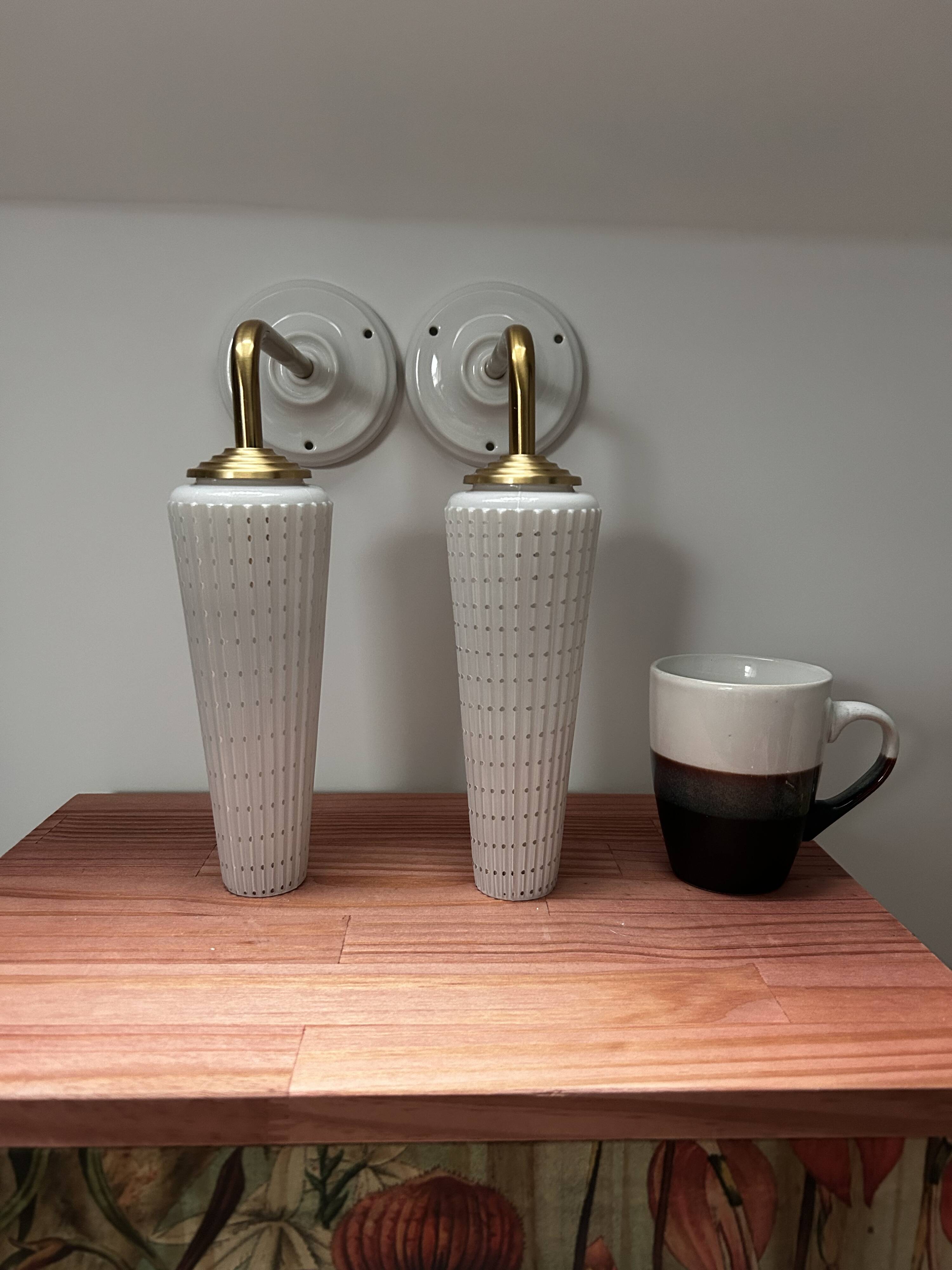 Pair of white and gold wall sconces