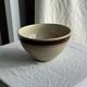 Large speckled beige salad bowl with ochre trim H14 D25