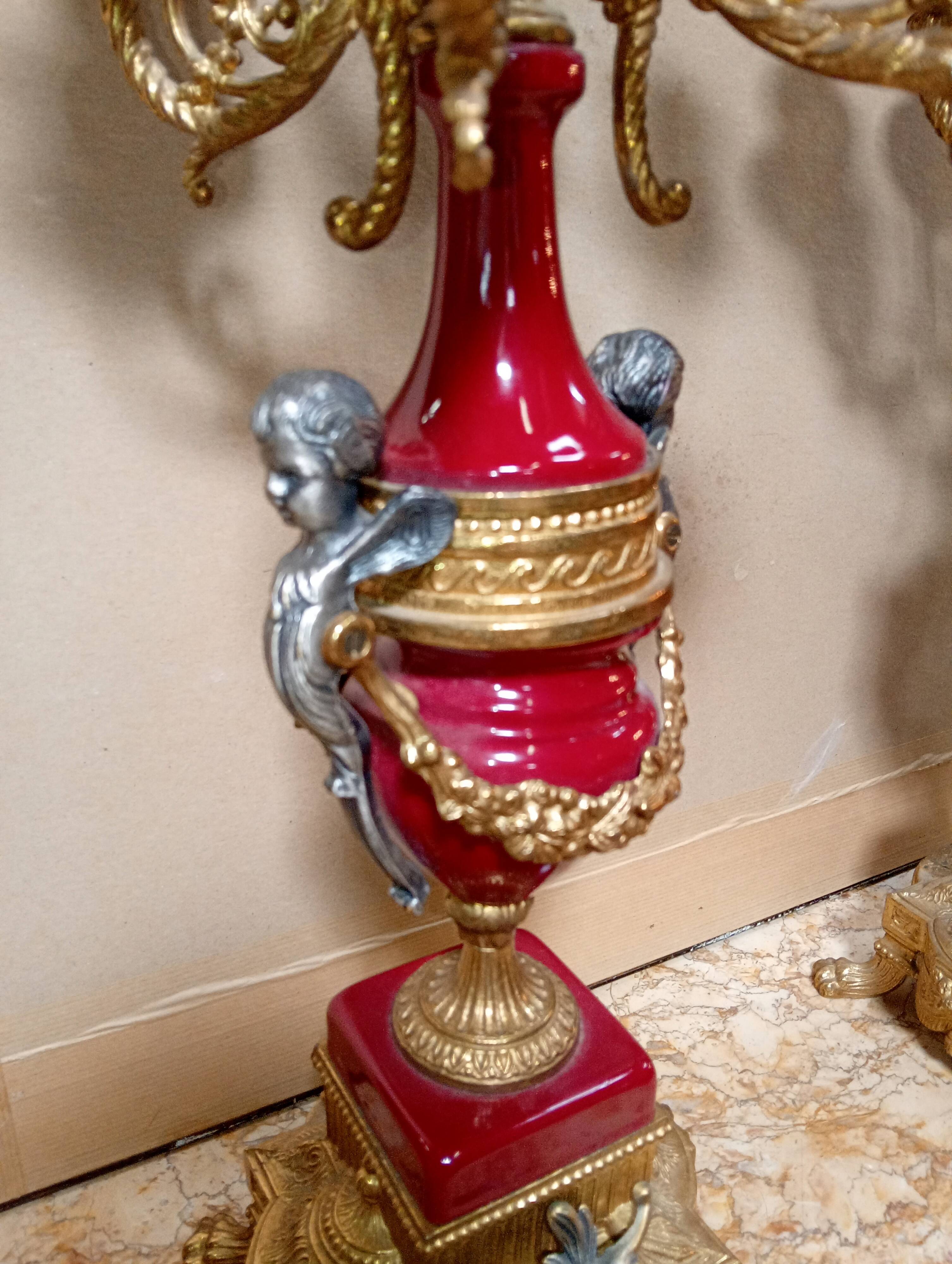 Pair of six-light candelabra in patinated and gilded bronze and spelter.