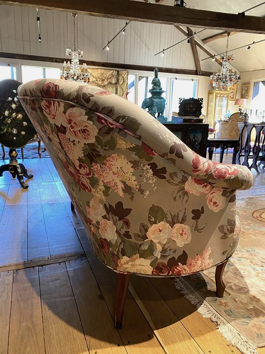 Napoleon III sofa upholstered in a floral patterned fabric