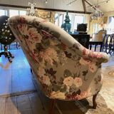 Napoleon III sofa upholstered in a floral patterned fabric