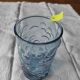 Blue glass with fruit relief decoration