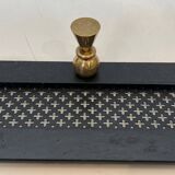 Coat rack in black lacquered metal, perforated sheet metal and brass in the style of Mathieu Matégot