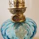 Large kerosene lamp mounted on bronze statue. Late nineteenth century