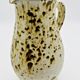 White, yellow and brown ceramic pitcher