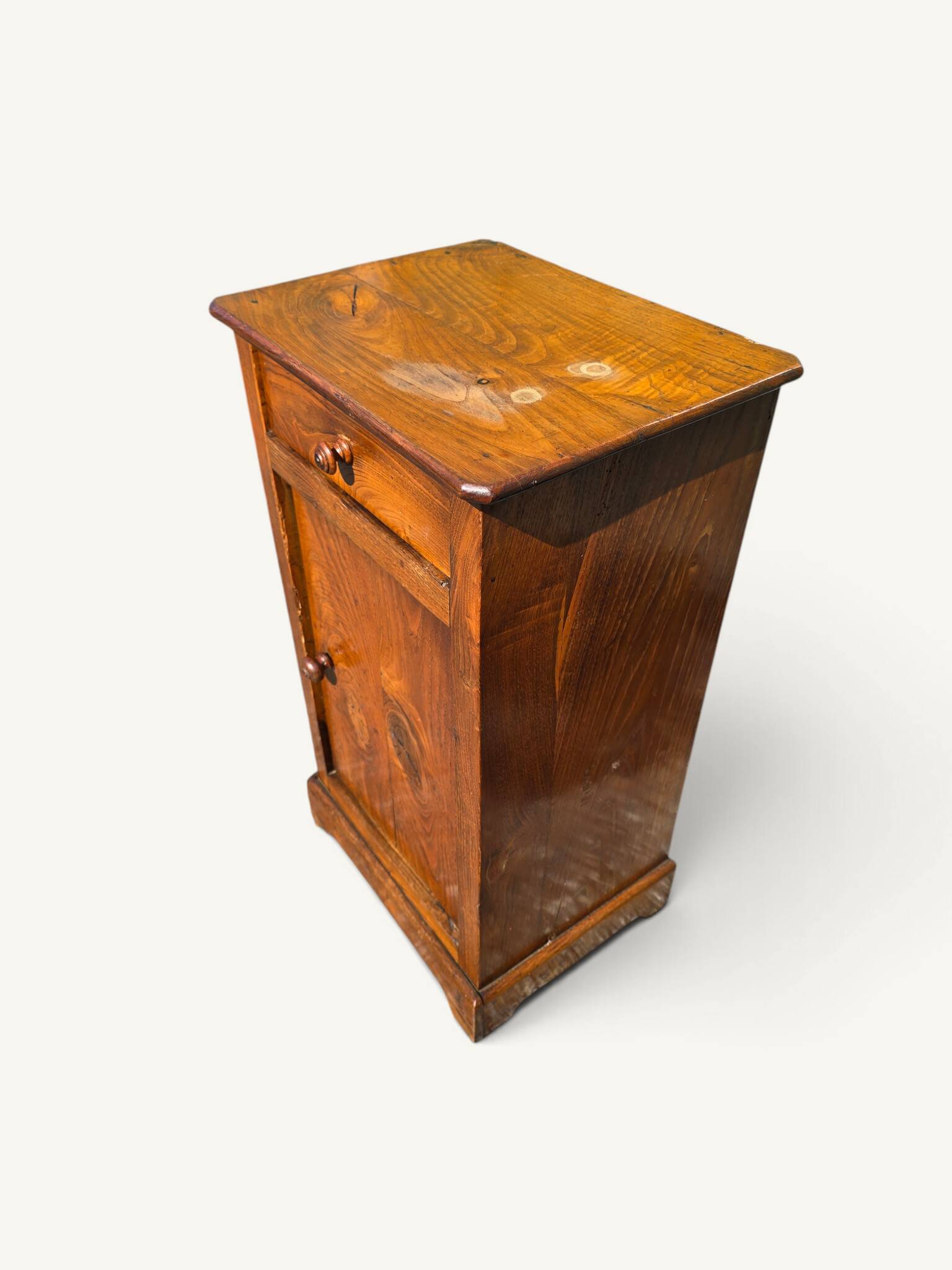 Small rustic antique bedside table made of solid wood.
