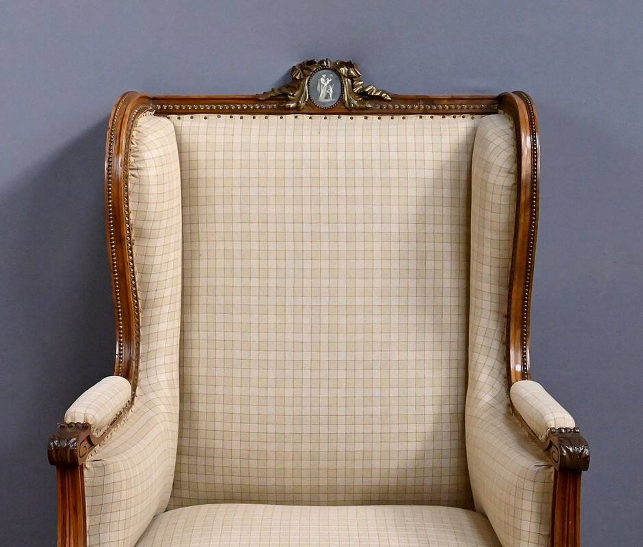 Wingback armchair in walnut, Louis XVI style – late 19th century