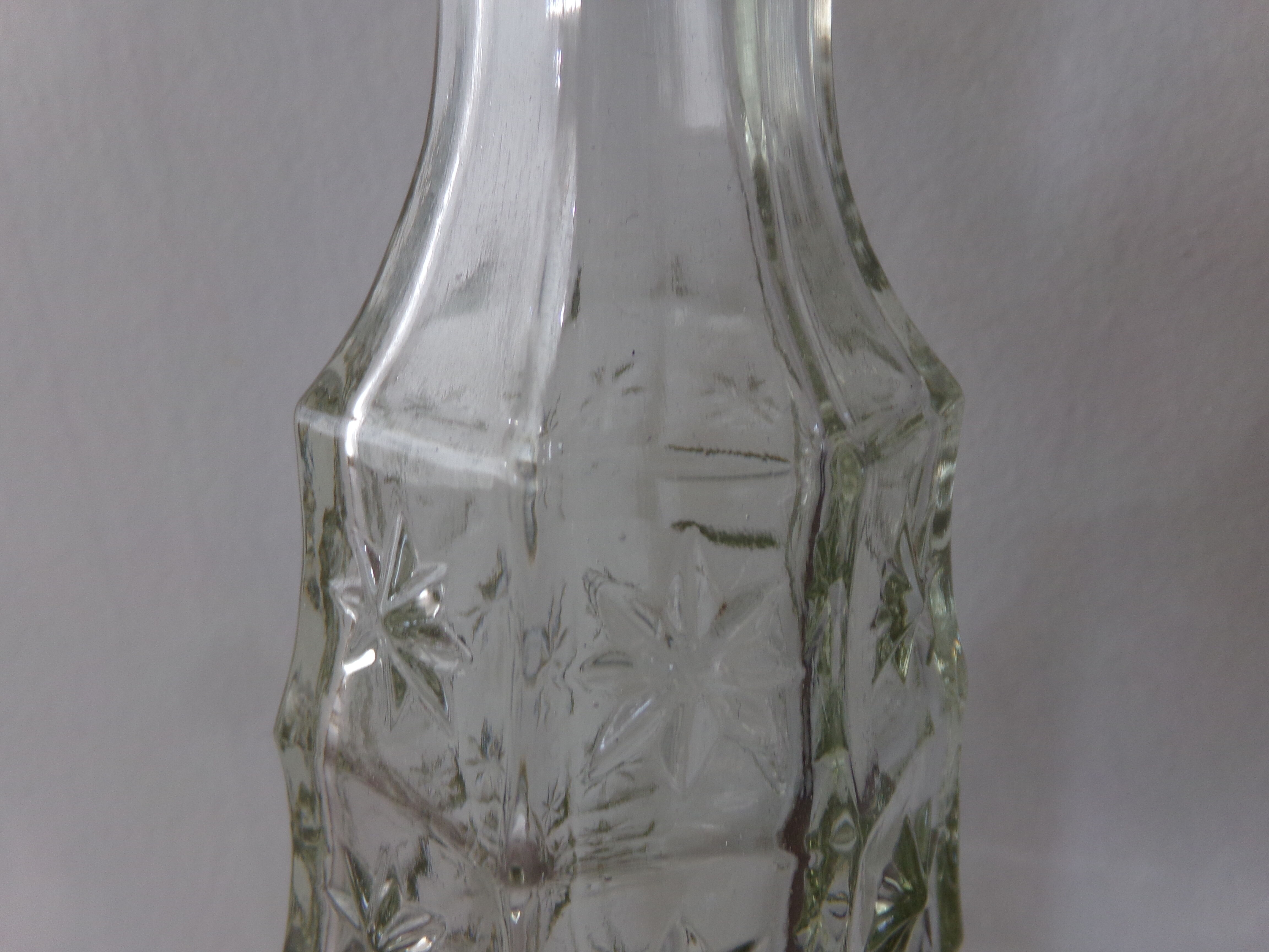 Chiseled glass bottle