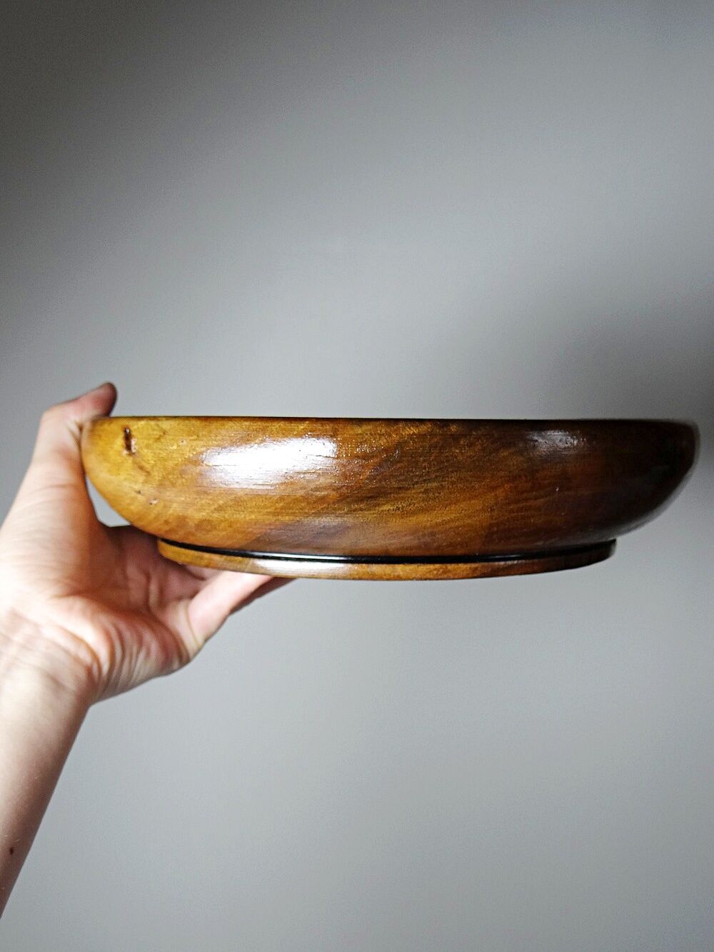 Teak or acacia wood bowl, vintage craftsmanship from the 70s to 2000s.