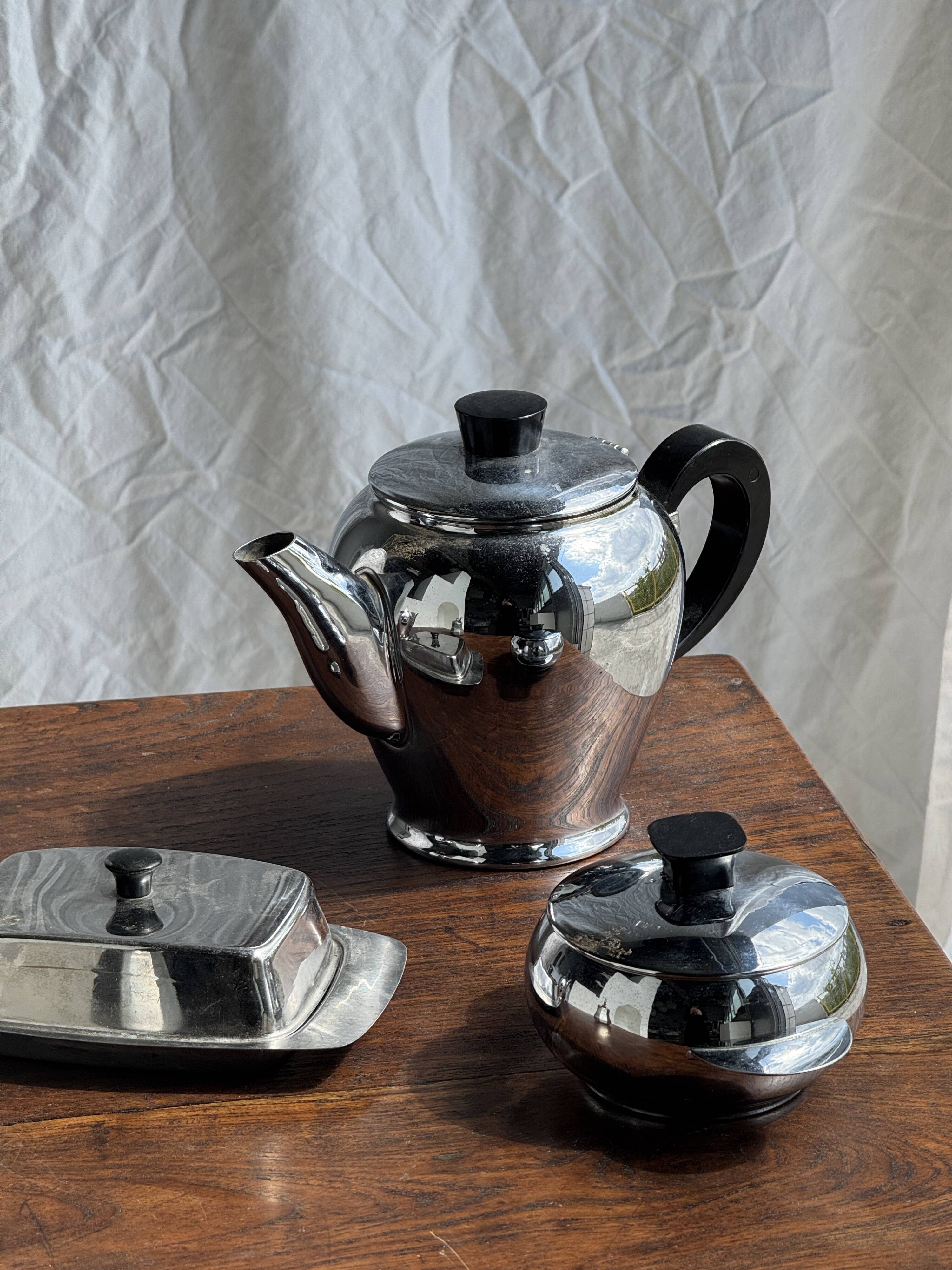 Tea set including teapot, milk jug, sugar bowl and butter dish