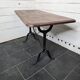 Bistro table with cast iron legs and solid wood top